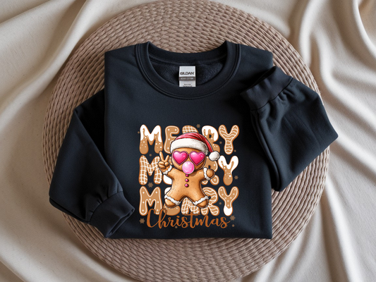 Black sweatshirt with 'Merry Christmas' gingerbread design on a textured surface